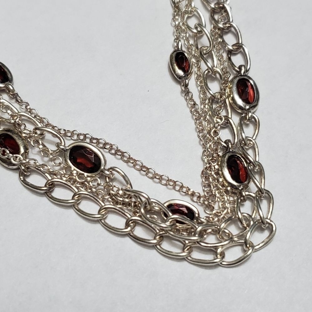Sterling silver layered bracelet with reddish stones 6.75"